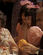 SAL TESSIO playfully tosses an orange into the air.