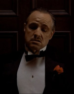 HAGEN: Virgil Sollozzo called. Now we're gonna have to give him a day sometime next week. / DON CORLEONE: We'll discuss him when you come back to California. I want you to talk to this movie big shot and settle this business for Johnny. Now if there's nothing else, I'd like to go to my daughter's wedding.